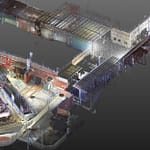 Sweeping digital 3D laser scanning view of an aerospace industrial corridor prepared for extensive mechanical renovations.